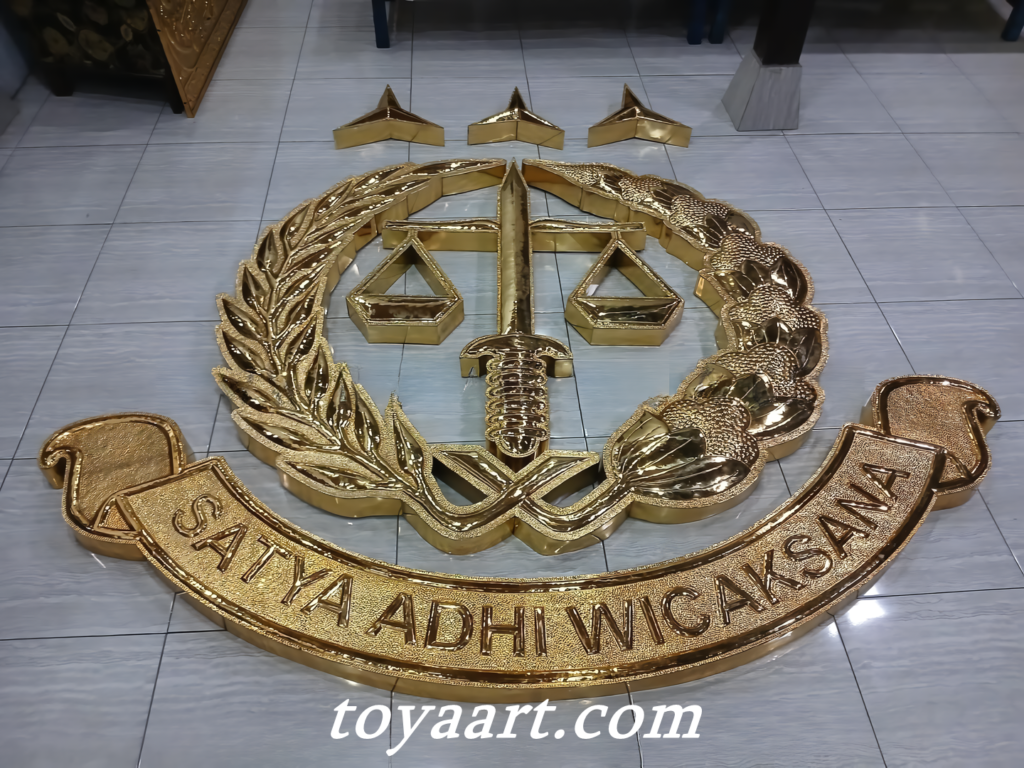 Lambang kejaksaan dengan warna hijau dan emas yang menggambarkan keadilan.